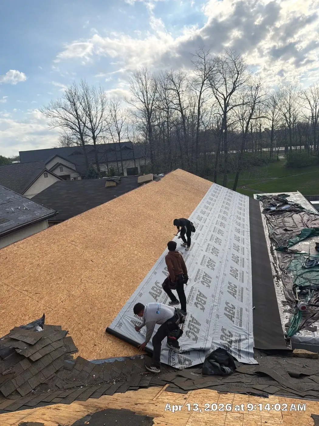 Tarping and dry-in on a Covington commercial roof